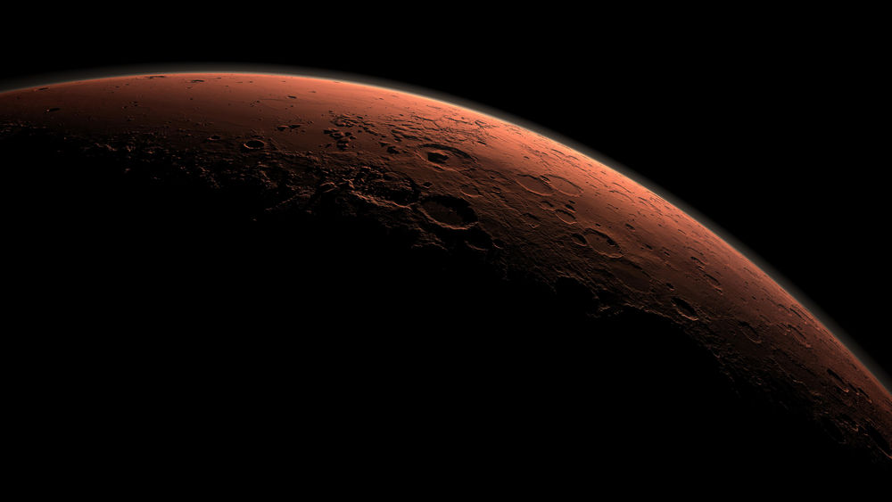 This computer-generated view depicts part of Mars at the boundary between darkness and daylight, with an area including Gale Crater beginning to catch morning light